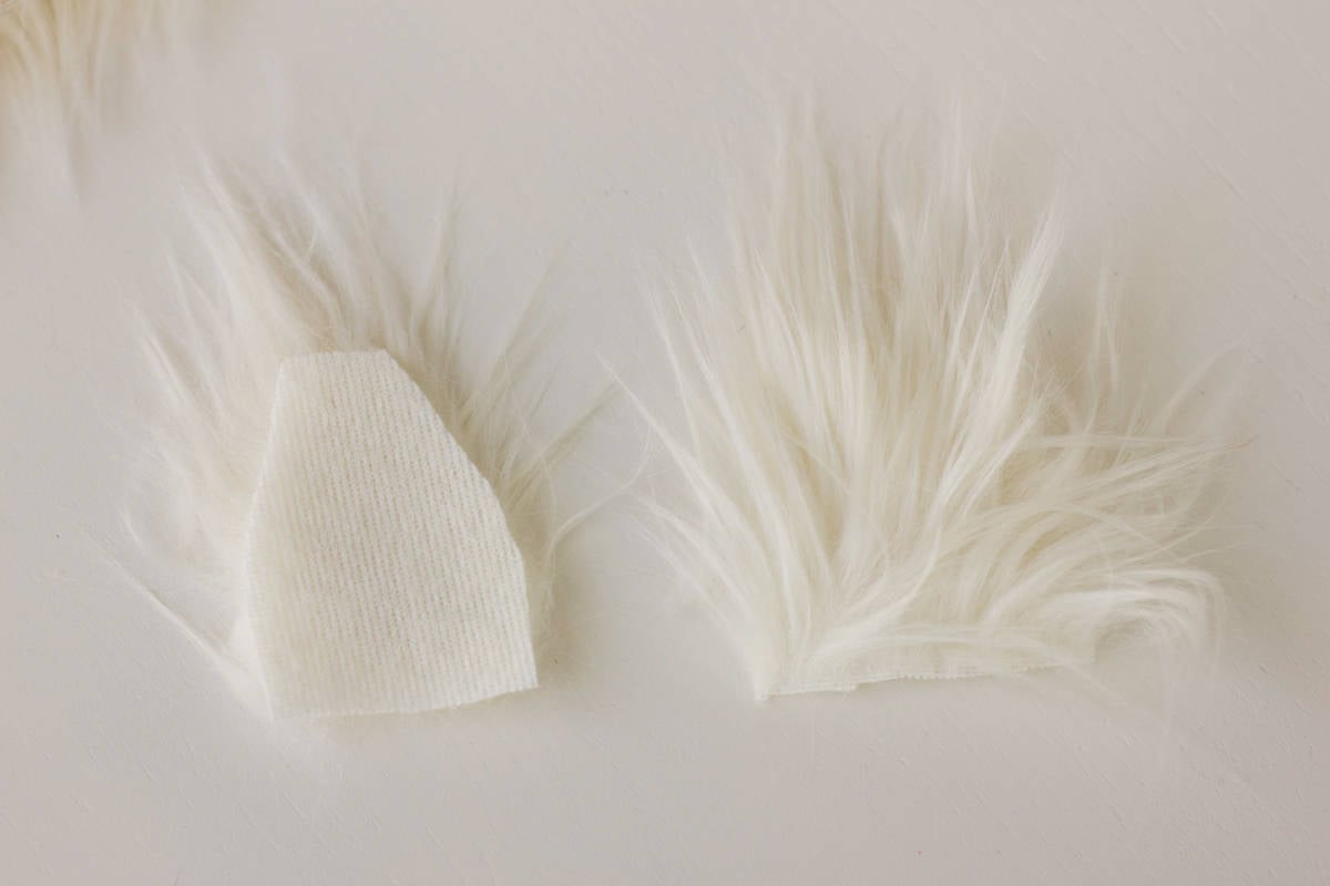 Adding white feathers as fur to your crochet or knit design.