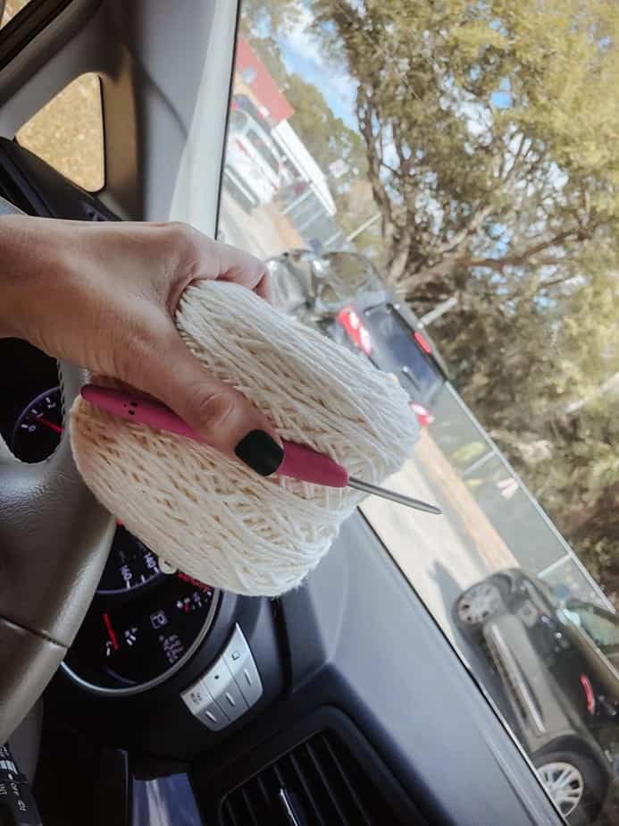 me holding yarn in car