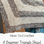 A person holds a crocheted triangle shawl in neutral tones. Text on the image reads: “How To Crochet A Hawthorne Tonal Crochet Shawl—Free Pattern + Video Tutorial.”.