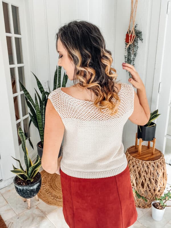 The back of a woman wearing a burgundy skirt and a white Summer Crochet Top.
