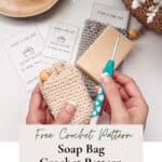 Hands holding a crochet hook and a beige soap saver crochet bag. Two finished crochet soap bags with soap are nearby, along with a lit candle and crochet pattern cards.