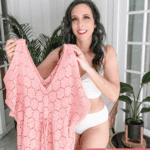 Woman in a white swimsuit holds up a pink Hexagon Cover-Up Crochet Pattern. Text on image highlights the cover-up as "simple & lightweight.