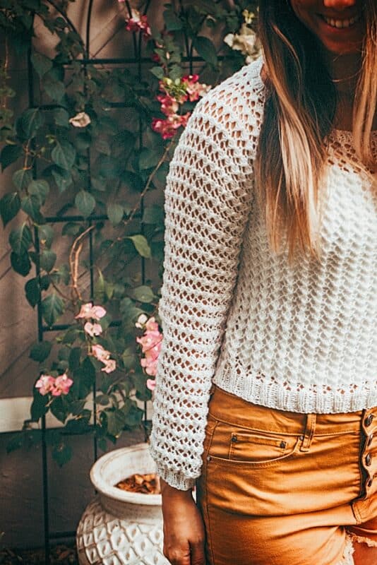 Girl in a hand knit white summer sweater