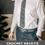 A black background with a black square, subtly accented by a crochet tie for a touch of texture.