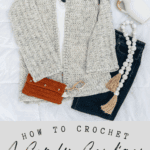 A crocheted cardigan is laid out with a white top, jeans, an orange clutch, a beaded necklace with tassels, and greenery, promoting the Get Comfy Crochet Cardigan Pattern with a free crochet pattern and video tutorial.