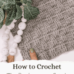 A hand with green nail polish touches a gray crochet fabric with a basketweave pattern, beside a leafy plant and white bead garland. Text reads: "How to Crochet The Basketweave and Alpine Stitch.