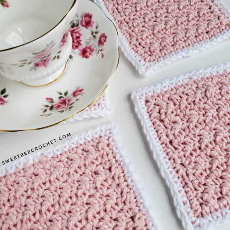 Crocheted coasters with a cup and saucer.