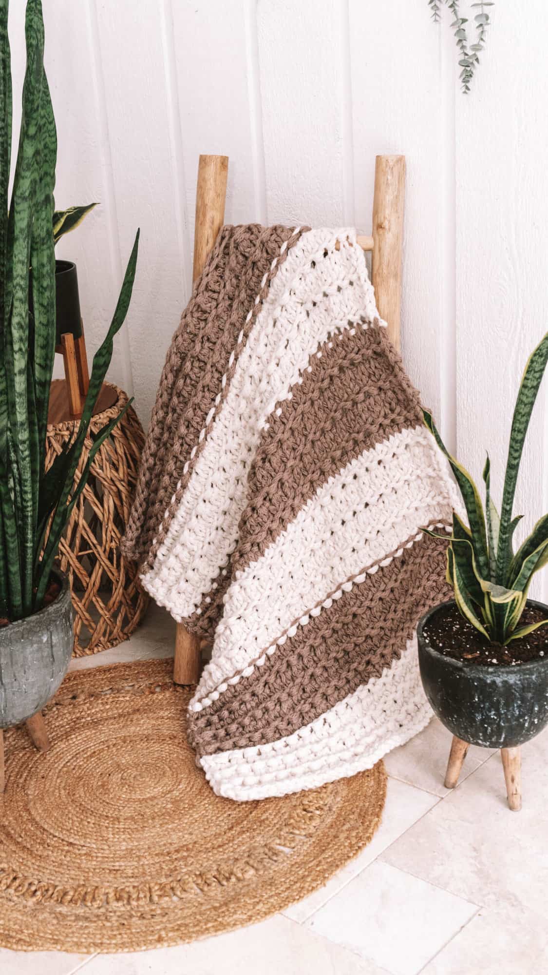 textured knit blanket pattern in brown and white yarn