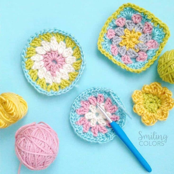Crochet granny squares and crochet hooks on a blue background.