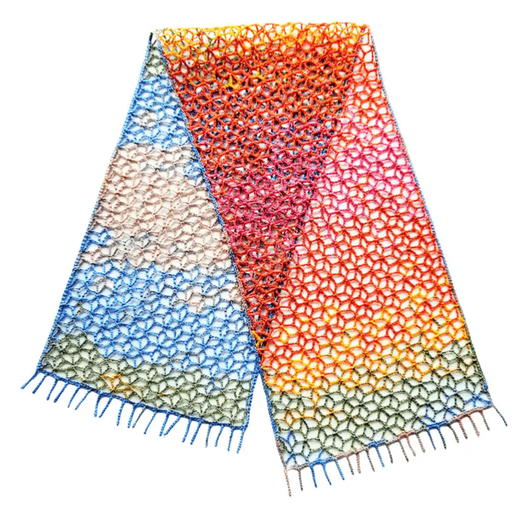 A colorful scarf with fringes on a white background.