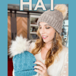 Woman wearing a knitted hat with a pom-pom, holding another hat in light blue. Text: "Free Crochet Pattern, Hat, Video Tutorial, Sizes Newborn-Adult Large.