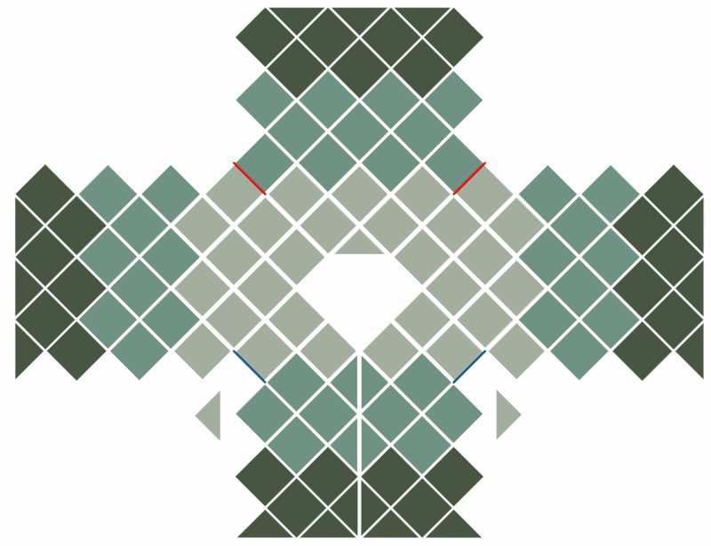 A crochet cardigan featuring green and red squares.