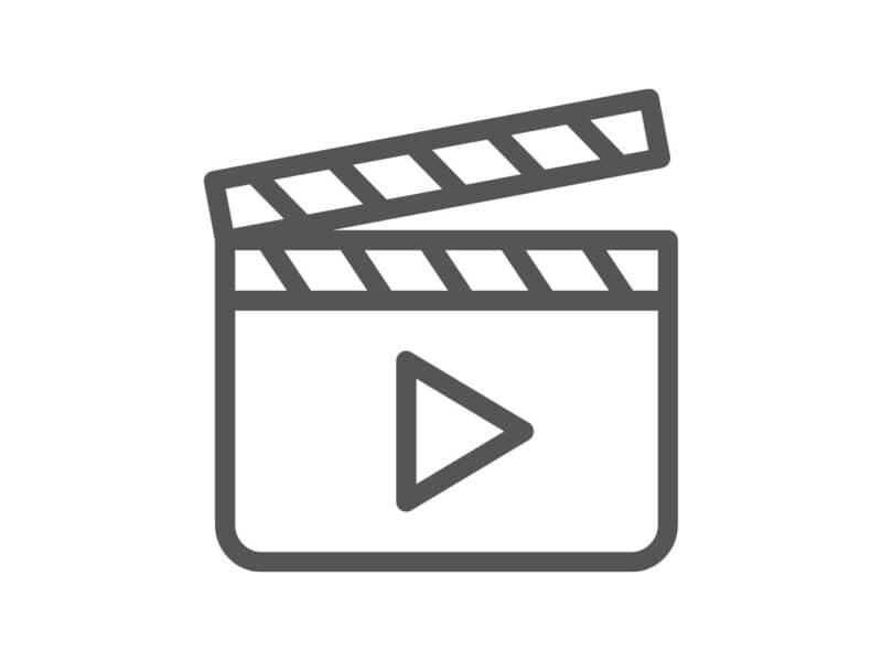 Icon of a clapperboard adorned with an Autumn Wheat motif and a play button, symbolizing video or film production.
