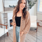 A woman wears a tan open-front Easy Crochet Cardigan over a black tank top and blue jeans, with text overlay reading “Easy Stitch Regency Crochet Cardigan” and the website address at the bottom.