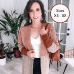 A person wearing a long, multicolored crochet cardigan is posing indoors with plants in the background. Text on the image promotes a free crochet pattern and video tutorial available at brianakdesigns.com.