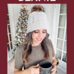 Person in a gray beanie holding a mug, standing in front of a decorated Christmas tree. Text reads "Snowy Wheat Puff Crochet Hat Pattern" and "Free Crochet Pattern + Video Tutorial".