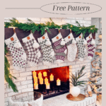 A fireplace decorated with knitted Christmas stockings, greenery, and candles, with a basket of yarn nearby.