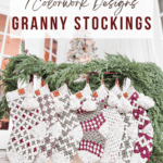 A display of six crocheted Christmas stockings featuring various colorwork designs, hung on a festive garland with greenery. Text reads: "7 Colorwork Designs Granny Stockings.