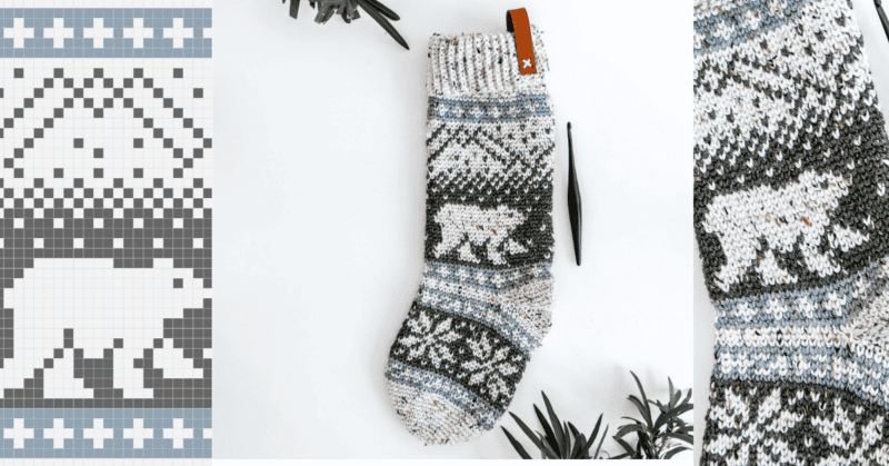 A knitted stocking with a polar bear and snowflake pattern, alongside a matching grid design and crochet hook, surrounded by sprigs of greenery.