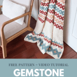 A colorful crochet blanket in gemstone hues drapes over a wooden ladder next to a cushioned chair. Text reads: "Free Pattern + Video Tutorial Gemstone Hues Crochet Blanket" with a website link at the bottom.