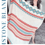 Person holding a handmade multi-colored crochet blanket with intricate geometric patterns. Text reads "Experience the beauty of gemstone hues with our Gemstone Crochet Blanket—Free Pattern + Video Tutorial.