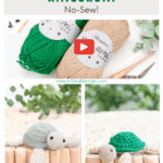 Two skeins of yarn, crochet hooks, and two handmade crochet turtle toys displayed on a wooden surface, promoting a free wheat stitch turtle amigurumi crochet pattern and video tutorial.