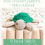 A crocheted amigurumi turtle with a green shell and beige limbs sits on a wooden surface; text offers a free pattern and video tutorial for the Wheat Stitch Amigurumi Turtle.