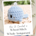 A crocheted blue whale amigurumi sits on wooden discs, with text promoting a free wheat stitch whale crochet pattern and video tutorial. Yarn and a hook are nearby.