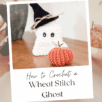 A crocheted ghost with a black witch hat and a small orange pumpkin displayed on a wooden surface; text advertises a wheat stitch ghost crochet pattern and tutorial.