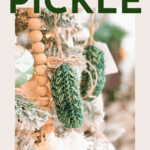 Crocheted green pickle ornaments hang on a Christmas tree with wooden bead garland, showcasing the Wheat Stitch Crochet Pickle Ornament Pattern and a free video tutorial.