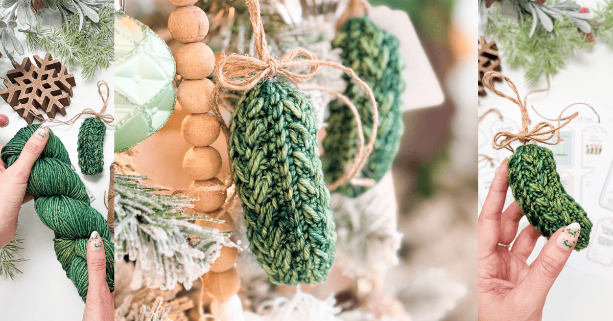 A hand holds green yarn, a crocheted green pickle ornament, and the pickle ornament hanging on a decorated Christmas tree with twine bow.