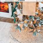 A decorated Christmas tree stands on a crocheted wheat stitch tree skirt with a fireplace in the background.