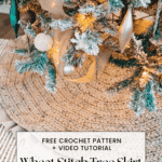 A Christmas tree with gold ornaments and ribbon stands on a woven, round tree skirt; text overlay offers a free crochet pattern and video tutorial for a wheat stitch tree skirt.