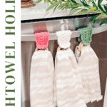 Three crocheted dishtowel holders with wooden rings—perfect for your kitchen or as a Wheat Stitch napkin ring crochet pattern—each hold a striped towel on an oven handle. Text reads "DISHTOWEL HOLDER Wheat Stitch™, Free Crochet Pattern + Video Tutorial.
