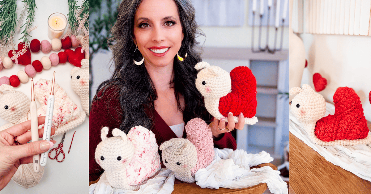 A woman displays handmade crochet snails with heart-shaped shells, crafted using the Wheat Stitch crochet heart pattern, surrounded by yarn, crochet hooks, and finished snail toys on a table.
