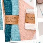 Three crocheted washcloths in blue, teal, and white with brown labels are displayed with yarn skeins and a pink crocheted cloth in the background.