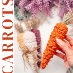 A hand holds an orange crocheted carrot with other crocheted carrots and purple yarn flowers in the background; text reads "Carrots Wheat Stitch™ Free Crochet Pattern + Video Tutorial.