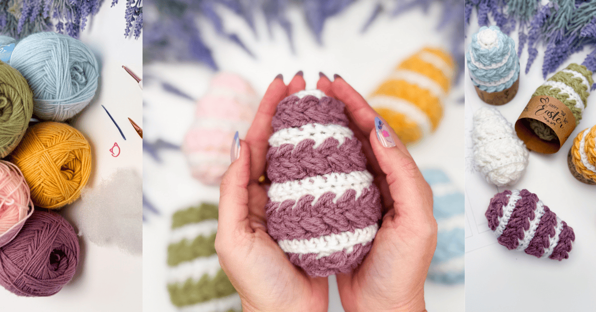 Hands hold a crocheted striped Easter egg made from the wheat stitch easter egg crochet pattern, surrounded by more crochet eggs and yarn balls in pastel colors on a white surface.