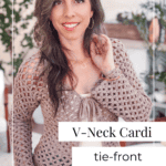 Woman wearing a Circle Leaf Lace Crochet Cardigan with a V-neck and tie-front, standing indoors in a bright room with plants and decor. Text on image reads "V-Neck Cardi tie-front.