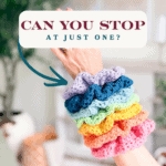 A hand wearing six colorful crocheted scrunchies with a text box that reads, "Can you stop at just one?"—plus, an arrow pointing to the scrunchies and a playful nod to the latest crochet nesting trays pattern.