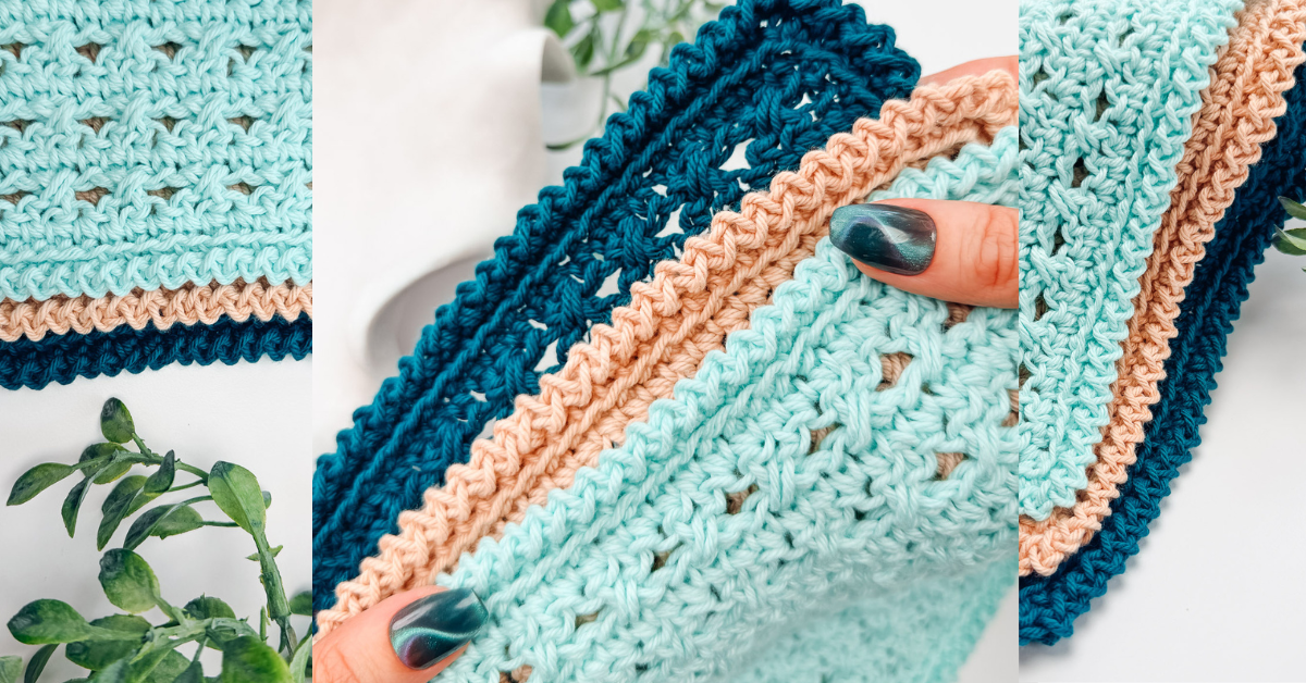 Close-up of a crocheted fabric in teal, beige, and mint colors, held by a hand with painted nails; green leaves are visible in the background.
