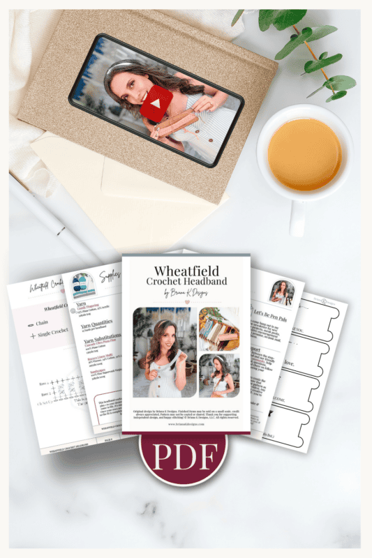 A cup of coffee, an envelope with a mobile device showing a woman’s video, and printed crochet headband PDF pattern sheets are arranged on a white surface.