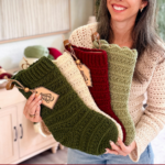 Woman holding three crocheted Christmas stockings in green, cream, and red. Text reads: "Petal Loop Stitch Crochet Stocking." Decor and yarn are visible in the background.