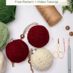 Three crocheted holiday ornaments, yarn, scissors, a crochet hook, a yarn needle, and gold ornament hangers arranged on a white surface. Text reads, "How to Crochet a Petal Loop Stitch Ornament.