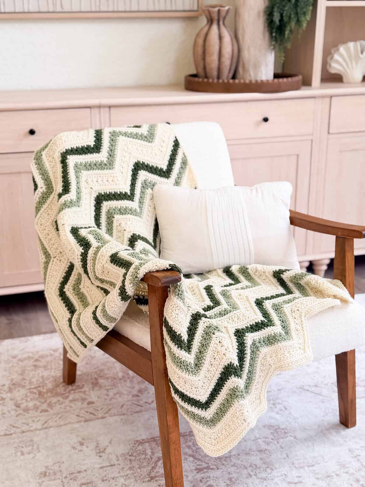 Petal Loop chevron crochet blanket in sage, evergreen, and cream