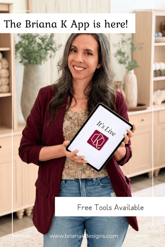 Woman in a maroon blazer holds a tablet displaying “It’s Live” and a logo. Text on the image announces “The Briana K App is here” and mentions free tools available, including a fun crochet game to spark your creativity.