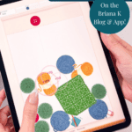Person holding a tablet displaying a crochet-themed game with yarn balls and a green crochet square, alongside promotional text for a free crochet game on the Briana K Blog & App. Dive into the fun and creativity of this engaging crochet game, perfect for yarn enthusiasts!.