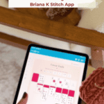 A hand interacts with a tablet displaying a crochet solitaire game called “Loose Ends,” with knitted items and a wooden chair visible in the background.