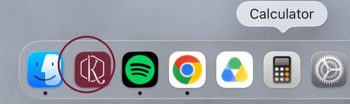A computer dock displays icons for Finder, a maroon hexagon app, Spotify, Chrome, Google Drive, Calculator, and System Preferences. The Calculator icon is highlighted, nestled beside what appears to be a unique crochet game icon among the familiar favorites.