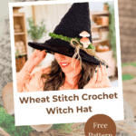 A person wearing a black, wheat-stitch crochet witch hat adorned with moss and mushrooms; text reads “Wheat Stitch Crochet Witch Hat” and “Free Pattern.”